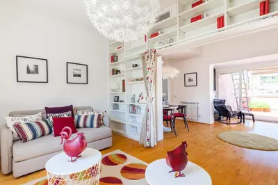 a living room with a couch and a table at Il Nascondiglio del Prete in Rome