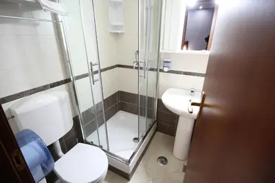 a bathroom with a shower and a toilet and a sink at Gold House in Rome