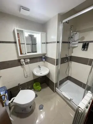 a bathroom with a shower and a toilet and a sink at Gold House in Rome