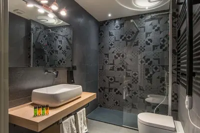 a bathroom with a sink and a shower and a toilet at Navona Street Hotel in Rome