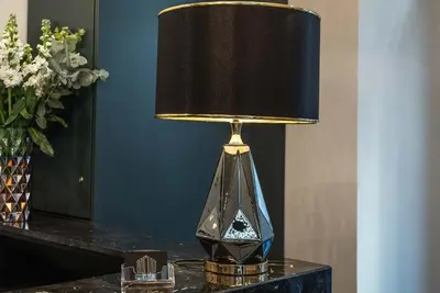 a lamp sitting on a table with a lamp on it at Navona Street Hotel in Rome