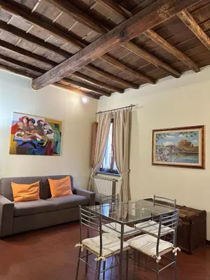 a living room with a couch and a glass table at Navona Apartment Livia in Rome