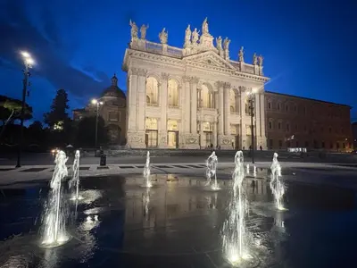 a building with water fountains in front of it at Long Bridge House in Rome