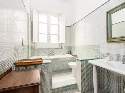 a bathroom with a tub and a toilet and a sink at Apartment Silla by Interhome in Rome