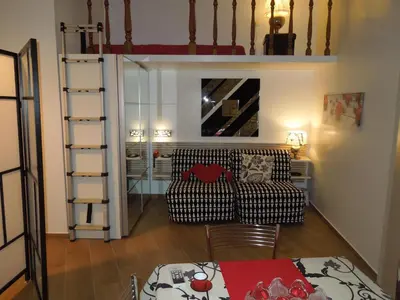 a living room with a couch and a table at A Casa Di Lucia in Rome