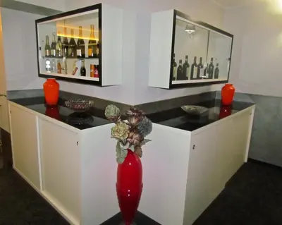 a bar with a red vase in a room at Brunelleschi Holidays Hostel in Rome