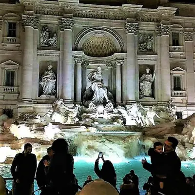 a group of people standing in front of a fountain at Casa Vacanze Colosseum by Serena in Rome