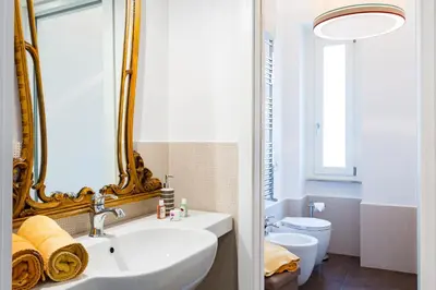 a bathroom with a sink and a mirror at Guest House Poerio88 in Rome