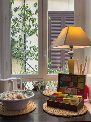 a table with a bowl of food and a lamp at Federici Guest House in Rome