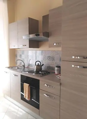 a kitchen with a stove and a tea kettle at Capital Flat 9/b in Rome