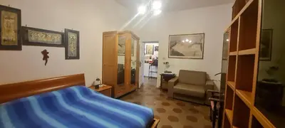 a room with a bed and a chair in it at Robta's Dream Home in Rome