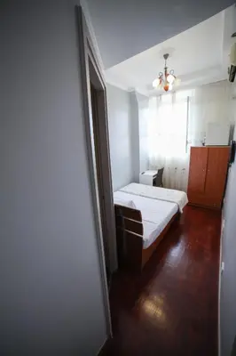 a small room with a bed and a window at KayDee GuestHouse in Rome