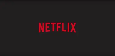 a red sign that says netflix on a black background at Central Vatican Rooms in Rome