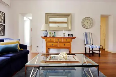 a living room with a couch and a table at YCH-Penthouse Fiammetta a Piazza Navona in Rome