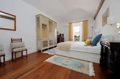 a white bedroom with a bed and a window at YCH-Penthouse Fiammetta a Piazza Navona in Rome