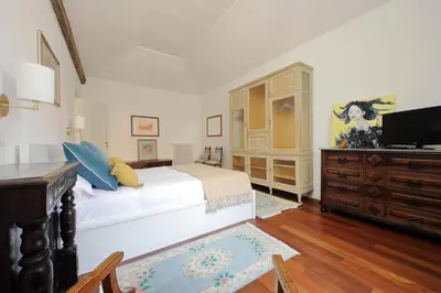 a bedroom with a large white bed and a dresser at YCH-Penthouse Fiammetta a Piazza Navona in Rome