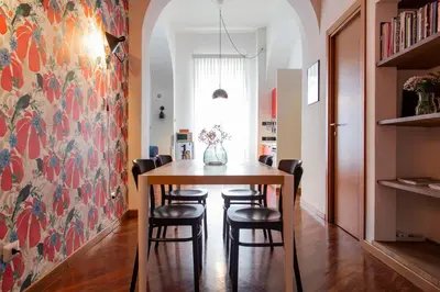 a dining room with a table and chairs at TrastevereHome - Garibaldi Rome in Rome