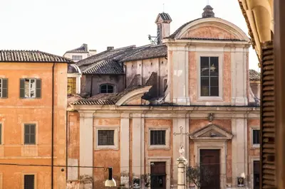 an old building in a city with a building at TrastevereHome - Ripa Rome Trastevere Home in Rome