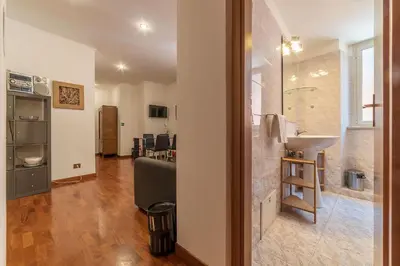 a bathroom with a sink and a mirror at Casa Zeffiro - FromHometoRome in Rome