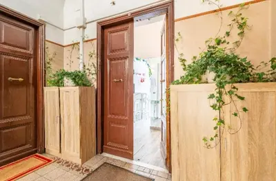 an empty room with a door and some potted plants at Rome sweet home in Rome
