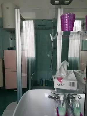 a bathroom with a sink and a bath tub at Il Vostro Comfort in Rome