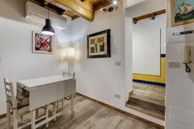 a home office with a desk and a lamp at Pellegrino Campo de' Fiori Suite in Rome
