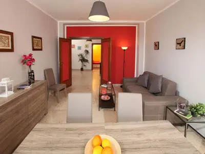 a living room with a couch and a table at Alice Home in Rome