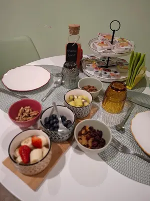 a table topped with bowls of fruit and nuts at Double B Ferruccio I in Rome