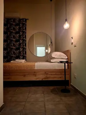 a bedroom with a bed with a mirror on it at Double B Ferruccio I in Rome