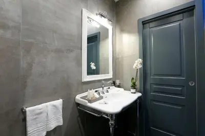 a bathroom with a sink and a mirror at Saint B Boutique Hotel STB in Rome