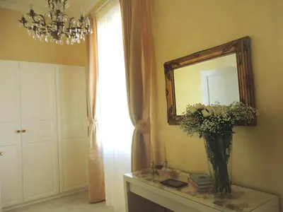 a bathroom with a sink and a mirror and a toilet at Cameo B&B in Rome