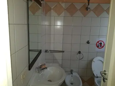 a bathroom with a sink and a toilet at Domina Romae B&B in Rome