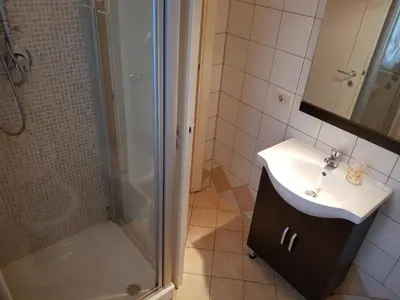a bathroom with a sink and a shower at Domina Romae B&B in Rome