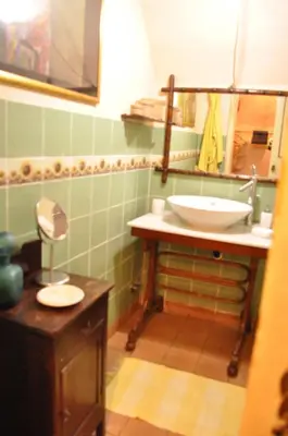 a bathroom with a sink and a mirror at Onofrio Flat in Rome