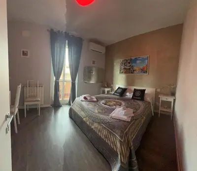 a bedroom with a large bed in a room at A 2 Passi Dai Musei Luxury Guest House in Rome