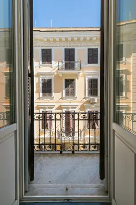 a view of a building from an open window at Tevere Rome Apartments in Rome