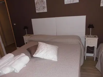 a bed with two pillows on it in a bedroom at Mikasa Piazza Bologna in Rome
