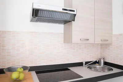 a kitchen with a sink and a bowl of apples at Justa casa Borgo Vittorio in Rome