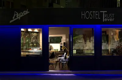 a building that is lit up at night at Hostel Trastevere in Rome