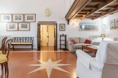a living room with a star on the floor at Campitelli Fascinating Apartment in Rome