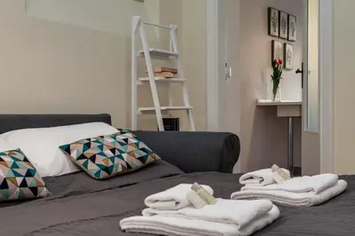 a room with a bed with towels on it at Romefinestay Apartments Sistina in Rome