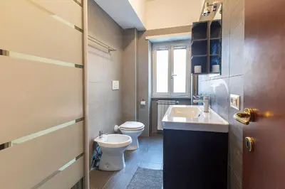 a small bathroom with a toilet and a sink at B&B Zen Trastevere in Rome