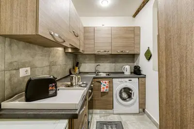 a kitchen with a washing machine and a sink at Deluxe Apartment - Campo dei Fiori in Rome