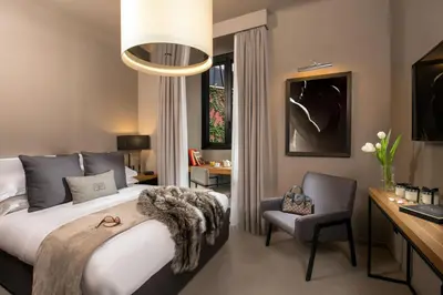 a bedroom with a bed and a desk and a chair at Parioli Place B&B in Rome