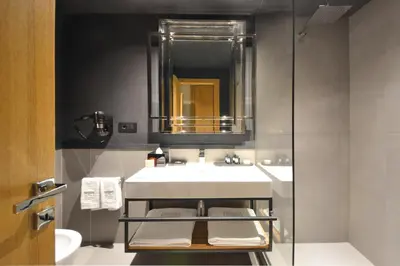 a bathroom with a sink and a mirror at Parioli Place B&B in Rome