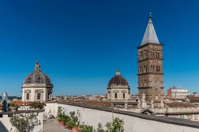 a view of a building with a clock tower at Moma Domus - Golden Keys Collection in Rome