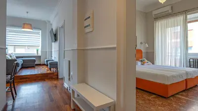 a bedroom with a floral wall behind a bed at Vatican Park Residence in Rome