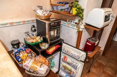 a small kitchen with an oven and food in it at Hotel Barrett in Rome