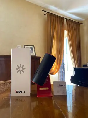 a box sitting on a floor next to a room with a television at Pantheon Old Suite in Rome