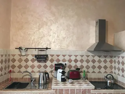 a kitchen with a sink and a stove at Pantheon Old Suite in Rome